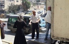 Jordanians share Eid bounty with Syrian refugees