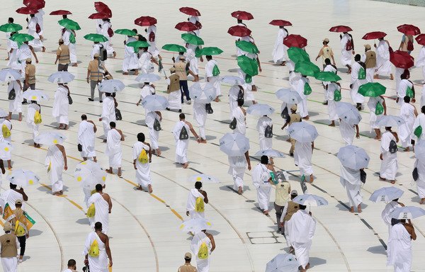 Pilgrims circumambulate the Kaaba, Islam's holiest shrine, at the start of the annual hajj on July 29th. [STR/AFP]