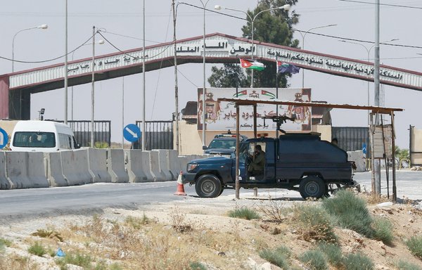 Jordanian troops guard the closed Jaber/Nassib border post at the kingdom's border with Syria last August 1. [Khalil Mazraawi/AFP]