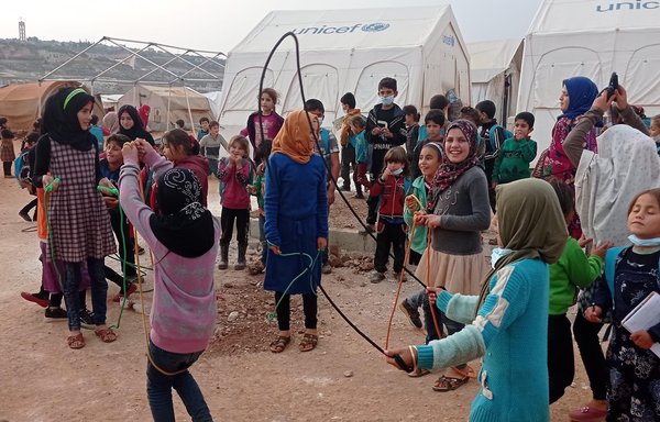 Children in al-Tah camp find the space to play their games using whatever they find to get their minds off the worries of the war and conditions of displacement. [Abdel Salam Youssef]