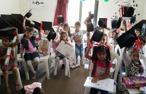 Syrian children attend a graduation ceremony at a Damma programme in Lebanon's Bekaa Valley. [Photo courtesy of Damma]