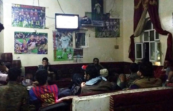 Sanaa residents gather to watch television together during Ramadan. [Faisal Darem/Al-Shorfa]