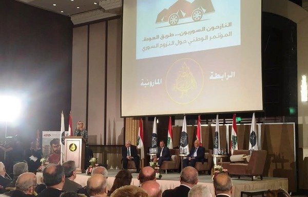 Lebanese officials discuss practical solutions to the Syrian refugee crisis during the 'Displaced Syrians, the Road Back' conference in Beirut. [Nohad Topalian/Al-Mashareq]