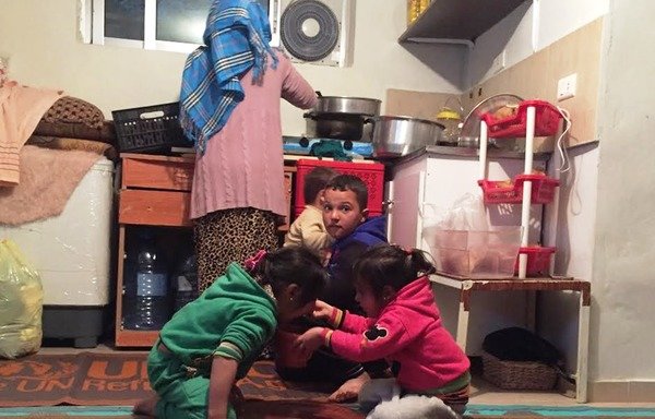 This Syrian family from rural al-Raqa, pictured on November 25th, has found refuge in Mazraat Yachouh in Mount Lebanon. [Nohad Topalian/Al-Mashareq]