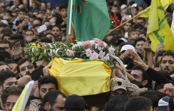 Supporters of Lebanon's Hizbullah attend the November 5th funeral in Beirut of a fighter killed in combat alongside regime forces in Syria. [Stringer/AFP]