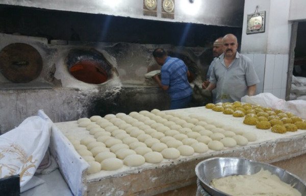 A bakery on Masaref street in Fallujah's busiest districts serves bread to fasters after iftar.