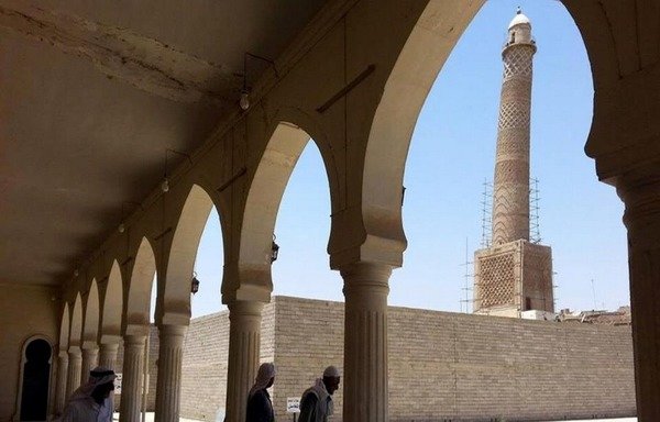 The leaning minaret of Mosul's al-Nuri mosque is seen from the interior of the mosque in this file photo. Both were destroyed by the 'Islamic State of Iraq and Syria' on June 21st. [Photo courtesy of Iraqi Military Encyclopedia]