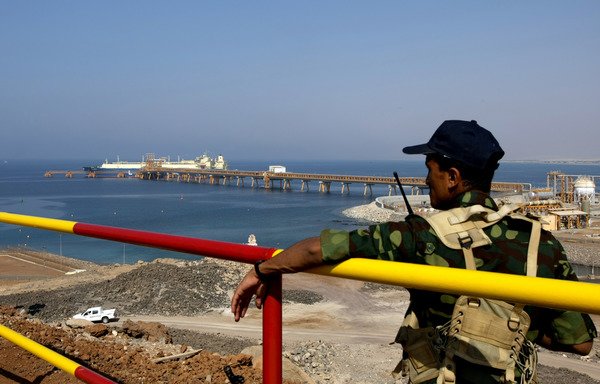In this file photo, a Yemeni soldier stands guard at the Balhaf liquefied natural gas plant on November 7th, 2009. In July 2017, al-Qaeda staged two attacks on soldiers guarding the facility. [Marwan Naamani/AFP]