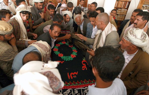Yemeni mourners carry the coffin of a soldier killed by al-Qaeda in Hadramaut province, during his funeral in Sanaa on August 10th, 2014. Al-Qaeda elements on July 25th ambushed and killed three soldiers in the province. [Mohammed Huwais/AFP]