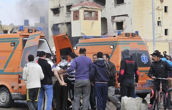 Egyptian emergency personnel move a victim into an ambulance following a car bomb explosion that targeted a police station in North Sinai's provincial capital of al-Arish on April 12th, 2015. The army has been scoring successive victories against militants in North Sinai as part of its operation 'Martyrs' Right'. [Stringer/AFP]