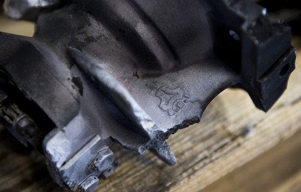 A placard showing a missile component recovered in Saudi Arabia reveals identity and logo of Iranian manufacturer Shahid Bagheri Industries Logo. [Jim Watson/AFP]