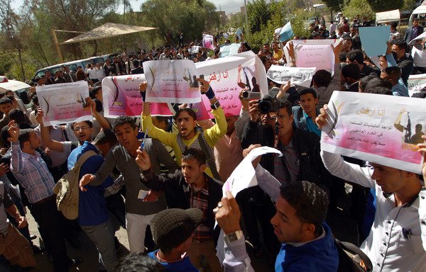 In this file photo from December 10th, 2014, Yemeni students take part in a rally to protest the Houthis' control of Sanaa University. The university's union is now protesting the militia's appointment of around 300 new pro-Houthi faculty members. [Mohammed Huwais/AFP]