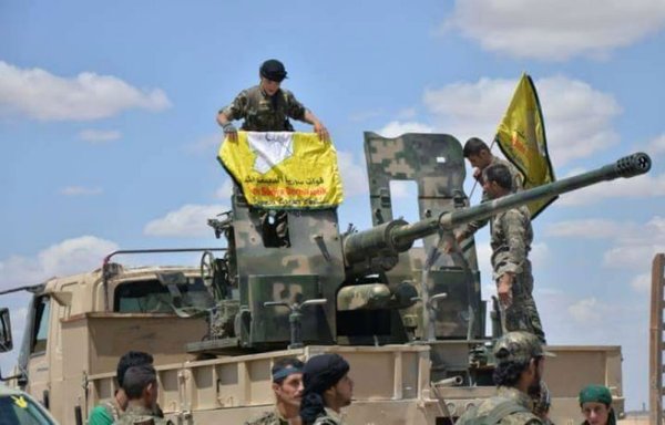 Fighters from the Syrian Democratic Forces take part in operation al-Jazeera Storm on the outskirts of the Syrian province of Deir Ezzor. [Photo courtesy of the Syrian Democratic Forces]