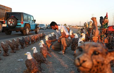 Squeezed by sanctions, Iranians seek day jobs in Iraq's Kurdish region