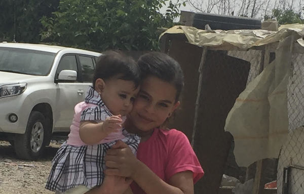 Syrian refugee children, pictured here, have been living in camps in Lebanon since they were born. Syrian refugees in Lebanon are encouraged to register the births of their children, as this will facilitate their eventual claim of Syrian citizenship and benefits. [Nohad Topalian/Al-Mashareq]