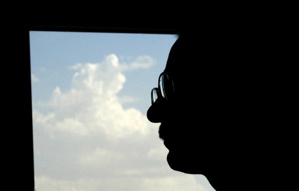 Iranian dissident academic Hashem Aghajari, who was jailed for two years after being initially sentenced to death for blasphemy, is seen during an interview with AFP at his office in Tehran on June 1st, 2005. [Behrouz Mehri/AFP]