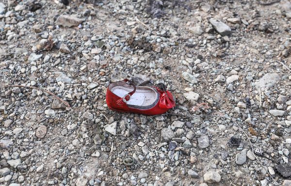 A child's shoe is pictured on January 8th at the scene of a Ukrainian airliner that crashed shortly after take-off near Imam Khomeini airport in the Iranian capital Tehran. [Borna Ghassemi/ISNA/AFP]