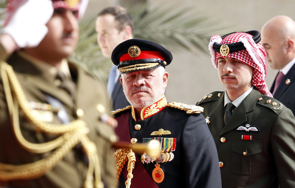 Jordan's King Abdullah and Crown Prince Hussein arrive for the opening session of the fourth ordinary parliamentary session in Amman on November 10th. [Khalil Mazraawi/AFP]