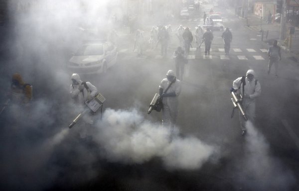 A photo taken on March 13th shows Iranian firefighters disinfect streets in the capital Tehran in a bid to halt the wild spread of novel coronavirus. [AFP]