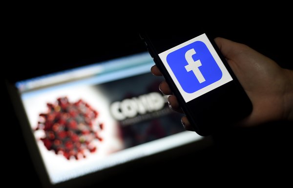 Facebook has removed hundreds of social-media accounts that were created before the coronavirus pandemic but had "opportunistically" used coronavirus-related posts to build an audience and drive it to their content. [Olivier Douliery/AFP]