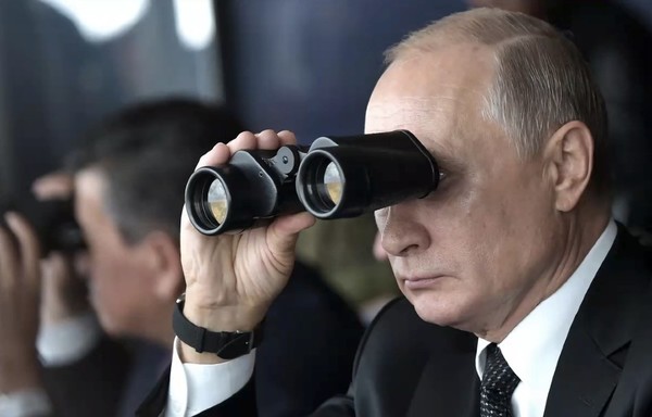 Russian President Vladimir Putin observes military manoeuvres during the Tsentr-2019 exercise last September. One of the clearest indications of the Kremlin's malign activity is its direct military interference in countries and regions deemed strategic to Moscow. [Kremlin]