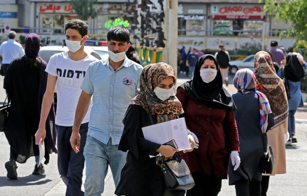 Iranians, mostly wearing face masks, are pictured in the capital Tehran on June 16th amid the coronavirus Covid-19 pandemic crisis. [ATTA Kenare/AFP]