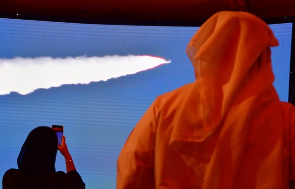 A picture taken July 19th shows a screen broadcasting the launch of the 'Hope' Mars probe at the Mohammed Bin Rashid Space Centre in Dubai.  [Giuseppe Cacace/AFP]