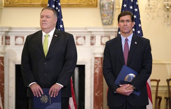 US Secretary of State Mike Pompeo (L) and Defence Secretary Mark Esper attend a news conference to announce the Trump administration's restoration of sanctions on Iran, on September 21st, at the US State Department in Washington, DC. [Patrick Semansky/AFP]