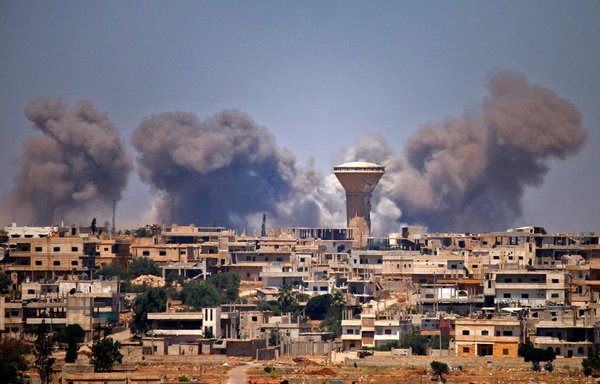 In this file photo taken July 5, 2018, smoke rises above opposition-held areas of the city of Daraa during reported air strikes by the Syrian regime. [AFP]