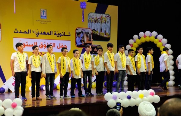 Lebanese students take part in a graduation ceremony at the Hadath branch of al-Mahdi High School in Baabda district. Hizbullah manages the al-Mahdi school network. [Hassan Ezzedine]