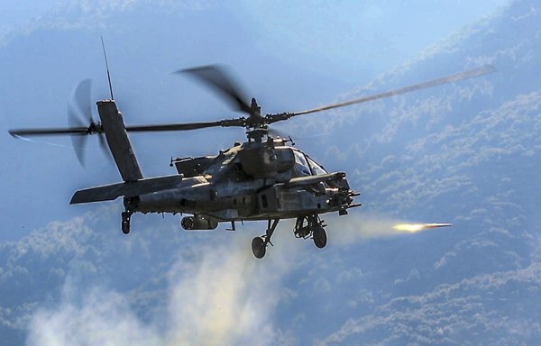 An Army AH-64 Apache helicopter fires a rocket during a combined arms live-fire exercise near Litochoro, Greece, January 23, 2019. [US Army]