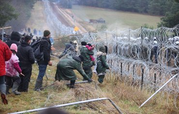 Desperate migrants in Belarus become Russia's geopolitical pawns