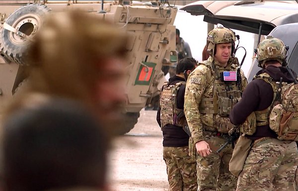 This screen grab from AFPTV shows US soldiers gathering in an area near the Kurdish-run Ghwayran prison in the northern Syrian city of al-Hasakeh on January 24. [Gihad Darwish/AFP]