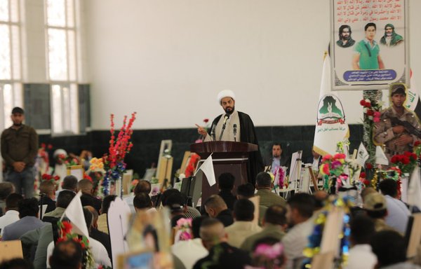 Qais al-Khazaali, the leader of Asaib Ahl al-Haq, attends a memorial ceremony for the militia's dead on May 4, 2019. [Al-Khazaali/Twitter]