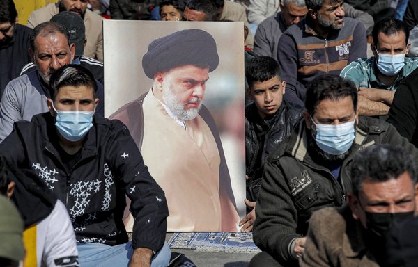 Supporters of Iraqi Muslim cleric Muqtada al-Sadr perform the weekly Friday prayers in Sadr city on January 28. After a meeting with al-Sadr February 8, IRGC-QF commander Esmail Qaani failed in convincing the different Shia political blocs in Iraq to remain united. [Ahmad al-Rubaye/AFP]