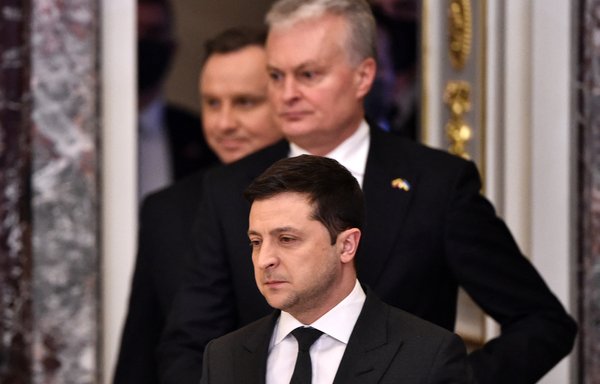 Ukrainian President Volodymyr Zelenskyy (front), followed by his Lithuanian and Polish counterparts Gitanas Nauseda and Andrzej Duda, arrives for a joint news conference following their talks in Kyiv on February 23. [Sergei Supinsky/AFP]