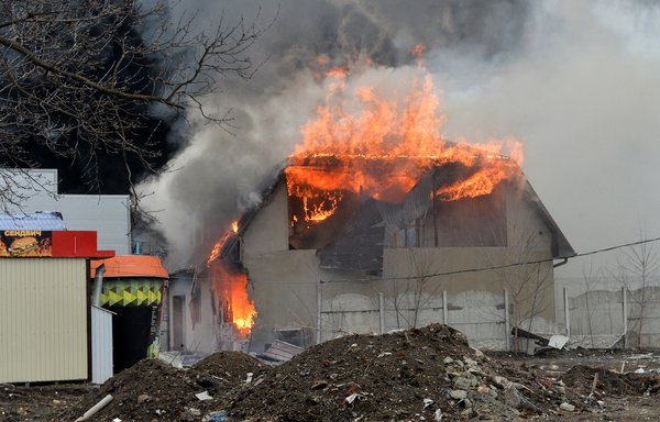 A burning building is pictured in Kharkiv, Ukraine, March 3 after shelling by Russian forces. Russia has been terrorising civlians in Ukraine, as the Soviet Union did in Afghanistan 40 years ago. [Sergey Bobok/AFP]