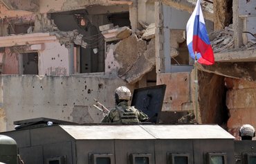 Russia steps up recruitment of Syrians for Ukraine, but how will it pay them?