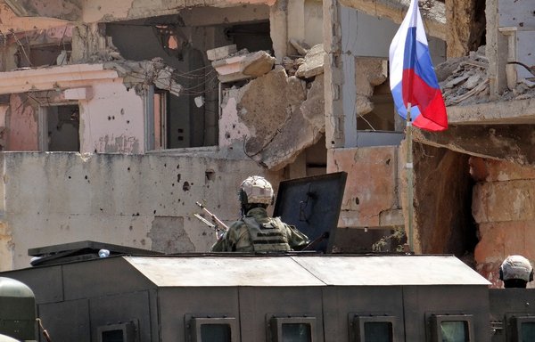 Russian troops patrol in the Syrian district of Daraa al-Balad in the southern province of Daraa, on September 1. [Sam Hariri/AFP]