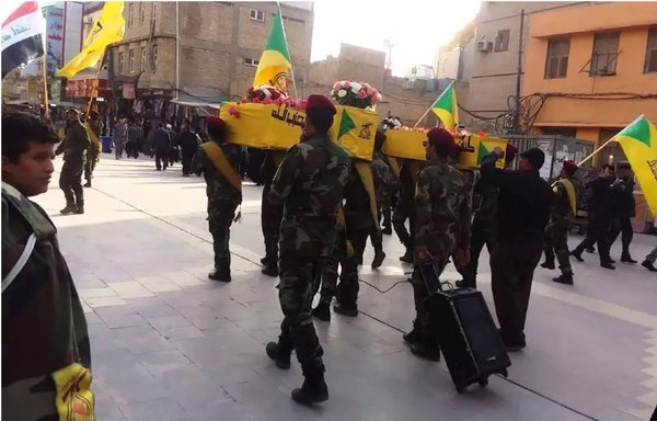 Kataib Hizbullah fighters hold a funeral procession for two elements of the militia, which is known for its fierce loyalty to Iran. [File]