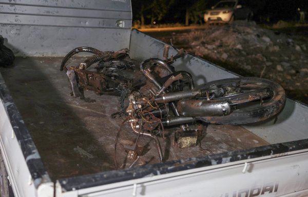 A picture taken early on June 28 shows the remains of the motorcycle ridden by Hurras al-Deen leader Abu Hamzah al-Yemeni, who was killed in a US drone strike on the eastern edge of Syria's Idlib province. [Omar Haj Kadour/AFP]