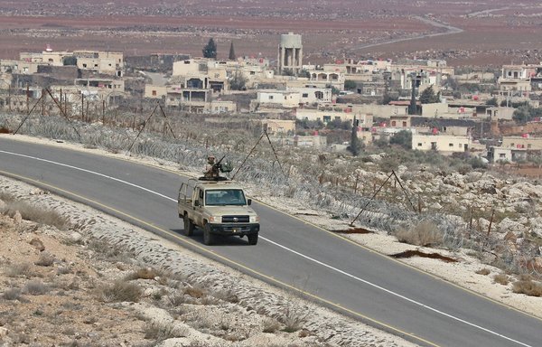 Jordanian soldiers patrol along the border with Syria to prevent trafficking on February 17. Drug trafficking from Syria into Jordan is becoming organised, with smugglers stepping up operations and using sophisticated equipment including drones, Jordan's army said. [Khalil Mazraawi/AFP]
