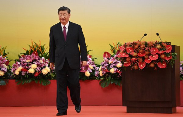 China's President Xi Jinping leaves the podium following his speech after a ceremony to inaugurate Hong Kong's new leader and government on July 1, the 25th anniversary of the city's handover from Britain to China. [Selim Chtayti/Pool/AFP]