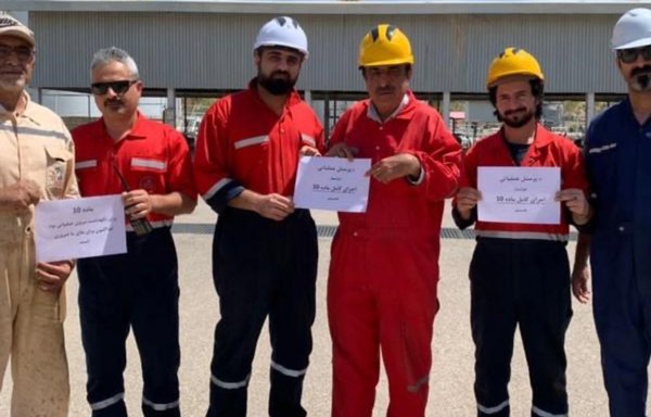 Oil workers voice their unmet demands for improved pay and safety conditions in Khuzestan on August 17. [Iran International]