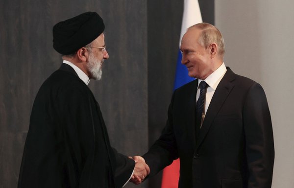 Russian President Vladimir Putin meets with his Iranian counterpart Ebrahim Raisi on the sidelines of the Shanghai Co-operation Organisation (SCO) leaders' summit in Samarkand last September. [Alexandr Demyanchuk/Sputnik/AFP]