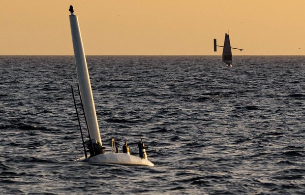 An Ocean Aero Triton unmanned surface vessel (USV), left, operates in the Arabian Gulf with a Saildrone Explorer USV during a bilateral exercise between the US Navy and United Arab Emirates Navy on February 16. [US Navy]