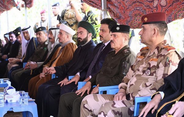 Security leaders, political figures and notables attend a February 22 funeral for the victims of an attack on the Diyala province village of al-Jayaila. [Security Media Cell]