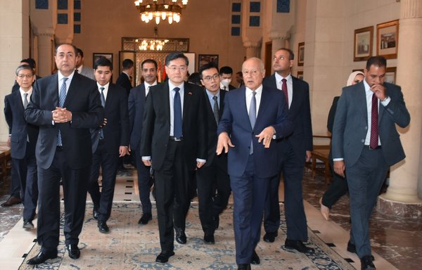 Arab League Secretary-General Ahmed Aboul-Gheit (C R) welcomes Chinese Foreign Minister Qin Gang (C L) and a delegation at the league's headquarters in Cairo on January 15. [AFP]