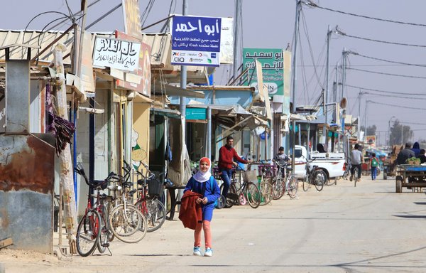 Bicycles line a thoroughfare in Jordan's al-Zaatari refugee camp on March 13. [Mohammad Abu Ghosh]