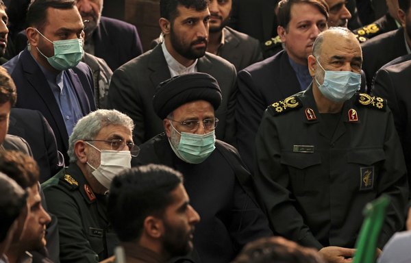 Iranian President Ebrahim Raisi (C) alongside IRGC Quds Force commander Esmail Qaani (L) and IRGC commander Hossein Salami attend a commemoration ceremony for slain IRGC Quds Force commander Qassem Soleimani in Tehran on January 3. [Atta Kenare/AFP]